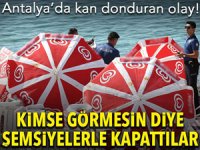 Sahilde kahreden görüntüye şemsiyeli kamuflaj